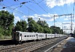 An eastbound 12 car NJT Arrow III Set deadhelds past Metuchen station